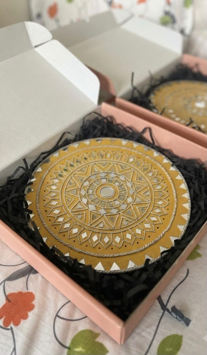 Swarna Chakra — 12-Inch Mustard Lippan Wall Hanging — handmade mustard-yellow base with white clay relief mandala and hand-cut mirror inlay by Rachna Saxena